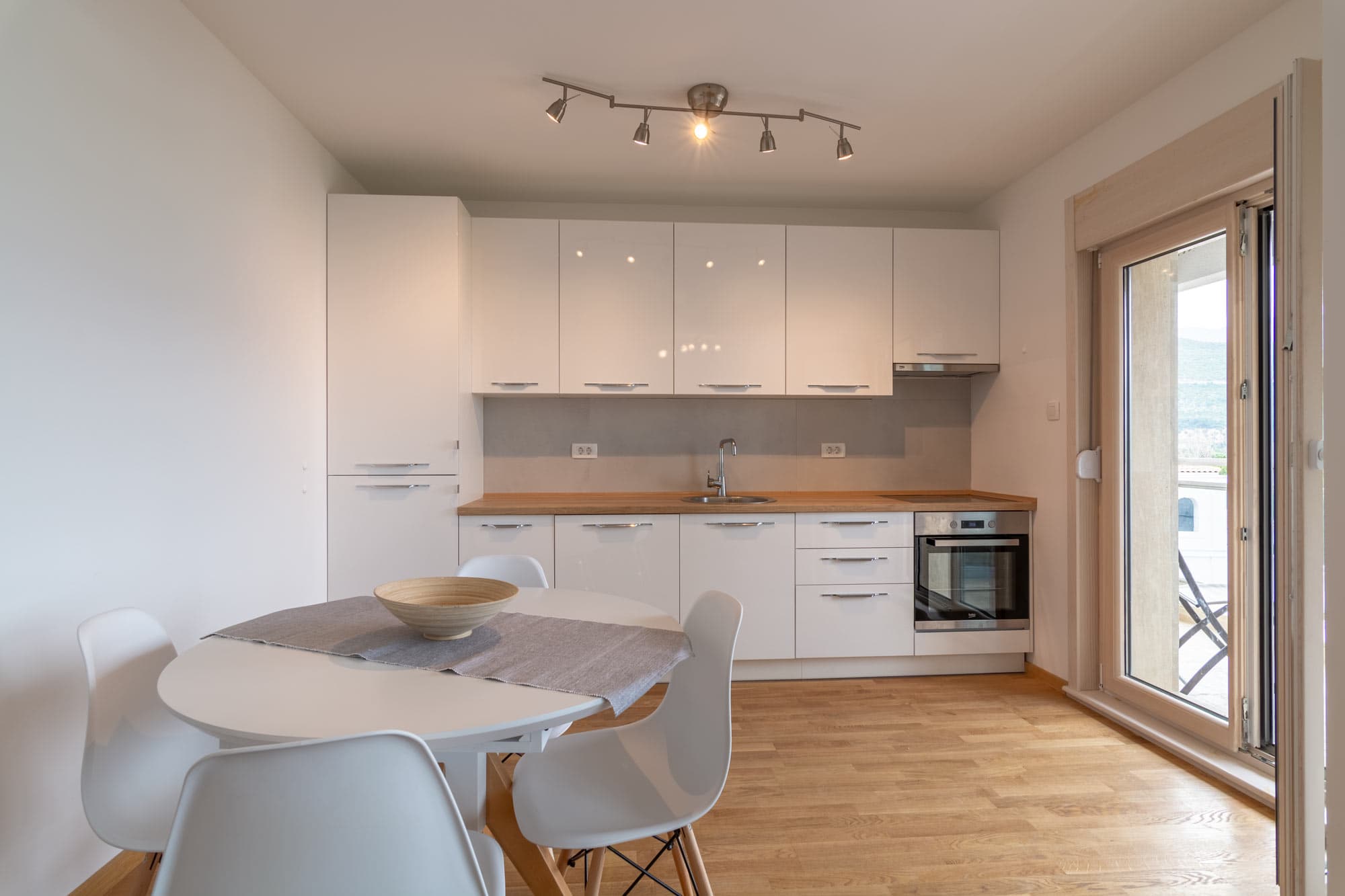 Bright modern kitchen with dining area in the Seaview Grand Apartment